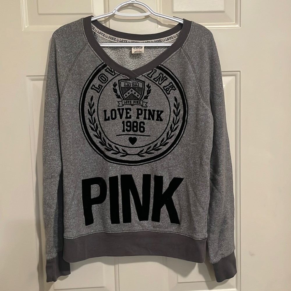 A gray V-neck pink Victoria’s Secret medium sweatshirt